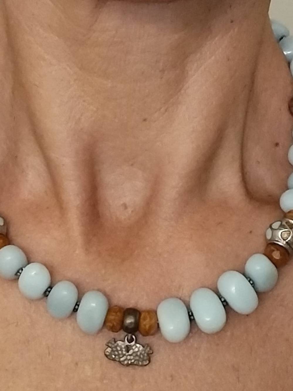 Light Blue Beaded Necklace with Amber Accents and Silver Charm